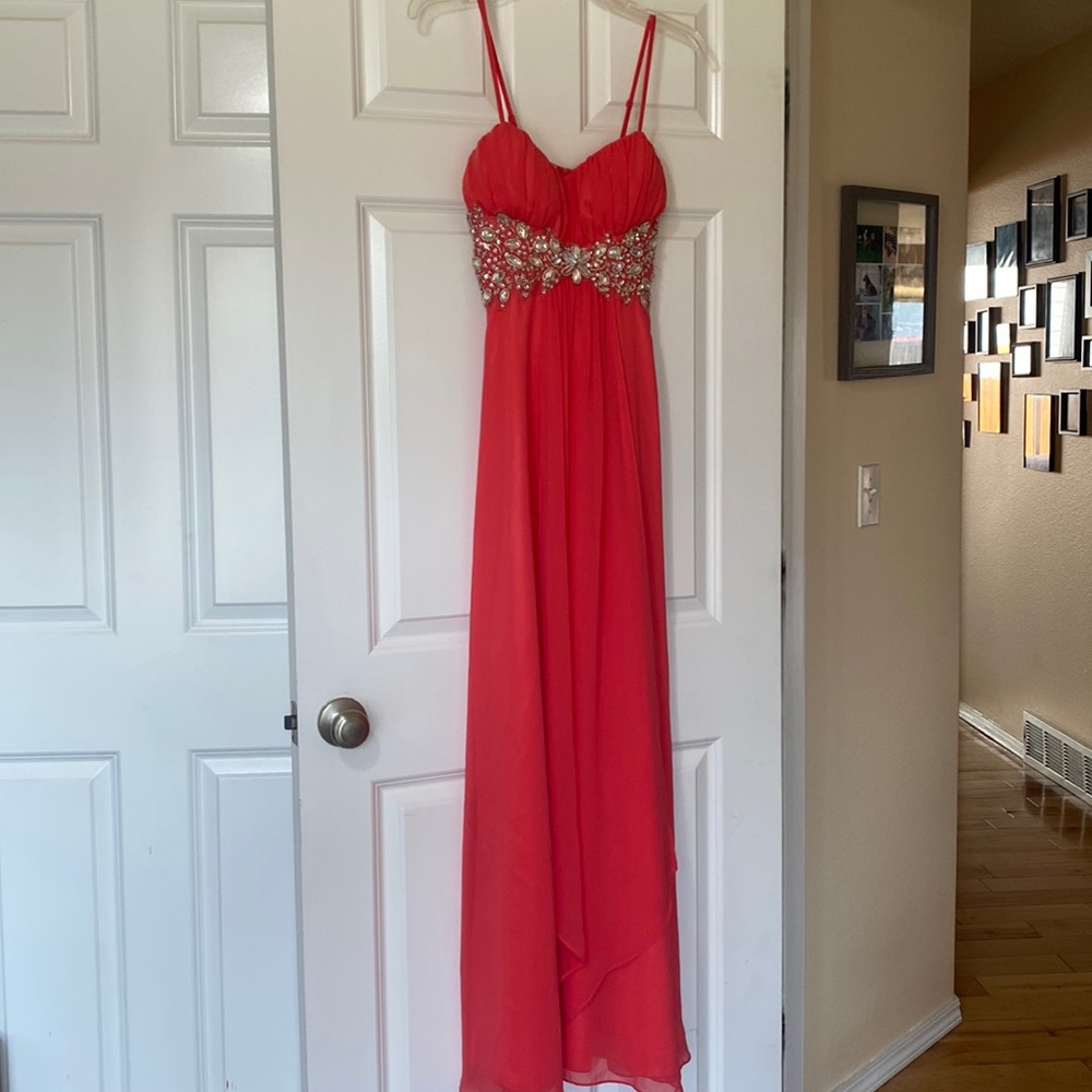 Formal dress. Never worn. Size is 1/2. Beautiful salmon color